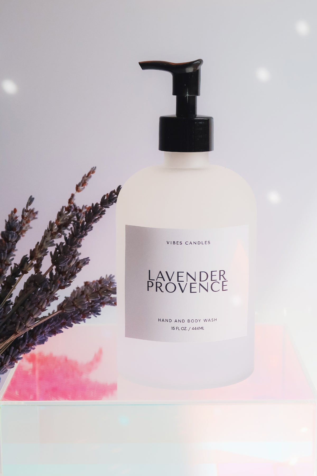 Lavender Provence hand and body wash bottle with lavender sprigs on a soft gradient background