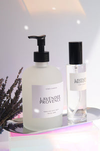 Two bottles of Lavender Provence products on a reflective surface with a blurred background.
