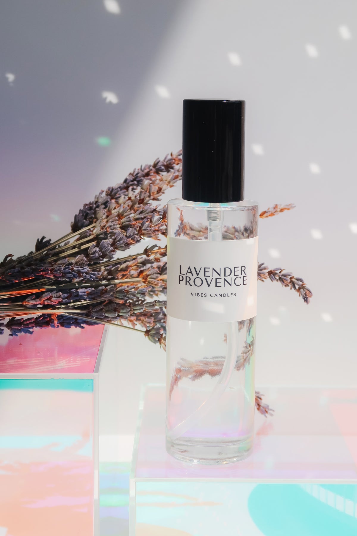 Lavender Provence room spray bottle with lavender flowers on a iridescent background